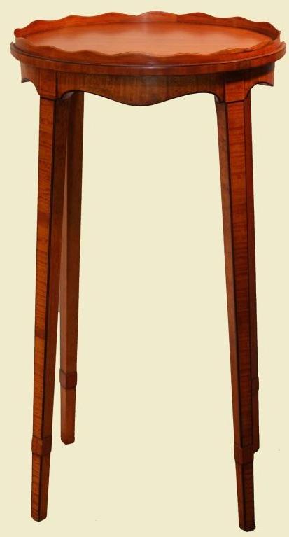 Pair of Hepplewhite sainwood oval urn stands, of typical form with undulating galleried tops and raised on square tapering legs.
This elegant pair have many features that are suggestive of the late 18th century.. The edges are ebonized, the legs are