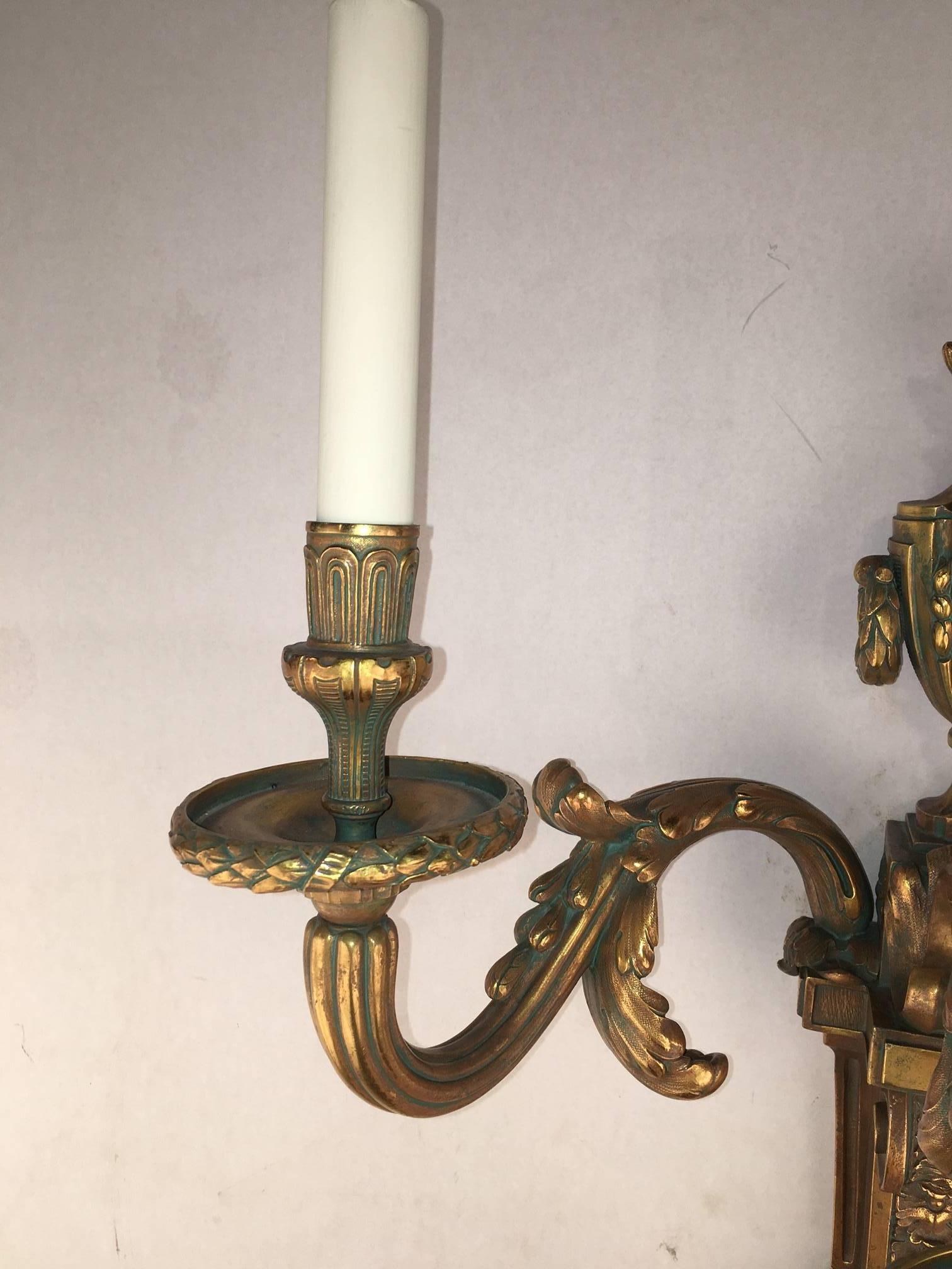 Cast Pair of Louis XVI Style Three-Light Wall Sconces For Sale