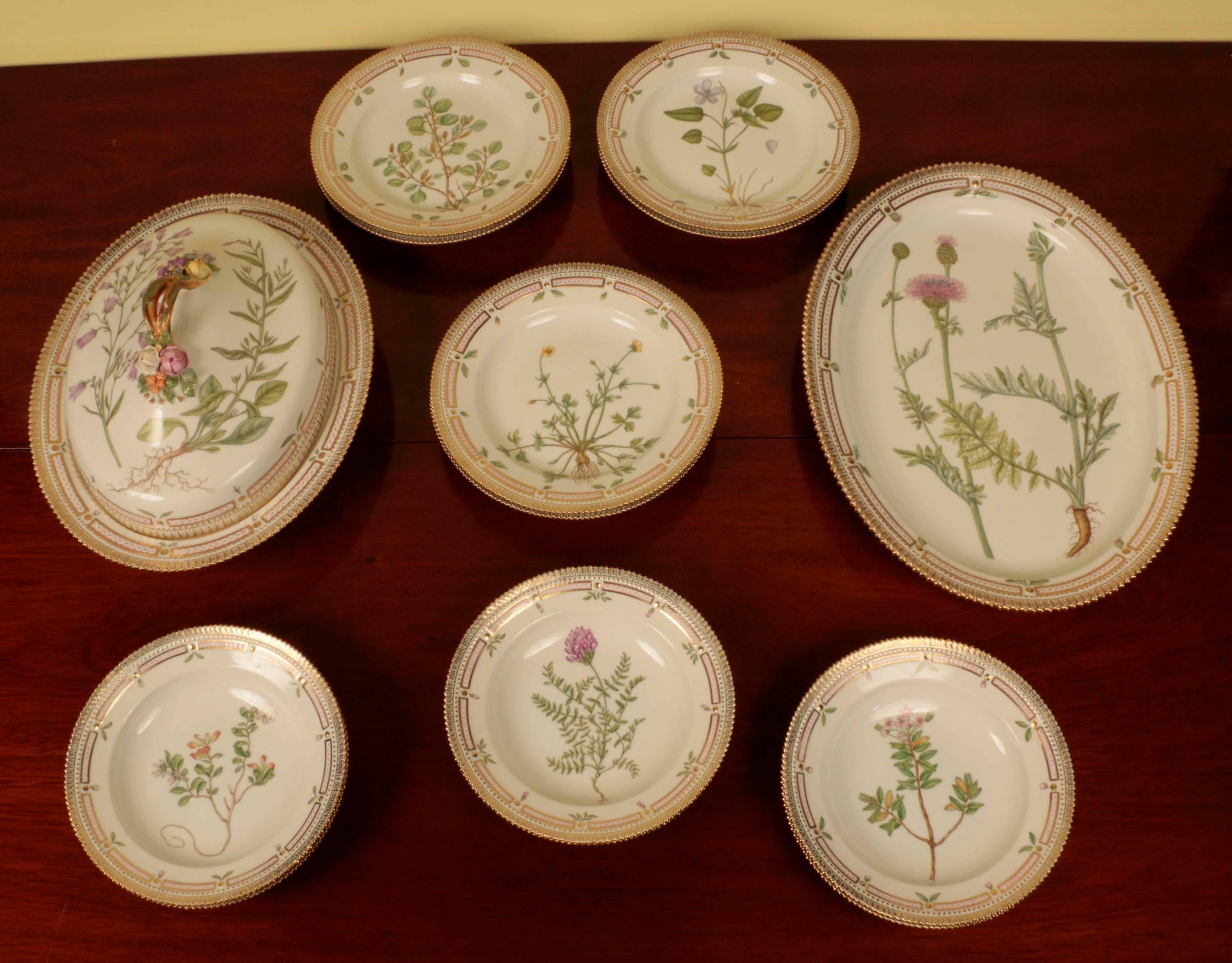 A part service of Royal Copenhagen Flora Danica porcelain. Each piece hand-painted with wildflowers within a moulded gilt and pink border.
Comprising:
A large oval meat or poultry plate beautifully painted with thistles; “Ceritaurea Scabiosa” 18 X