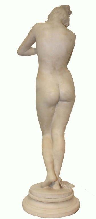 White marble statue of Phryne, and her spilled oil lamp, on stepped circular socle.
Signed, E(rcole) Rosa, (1846-1893.)