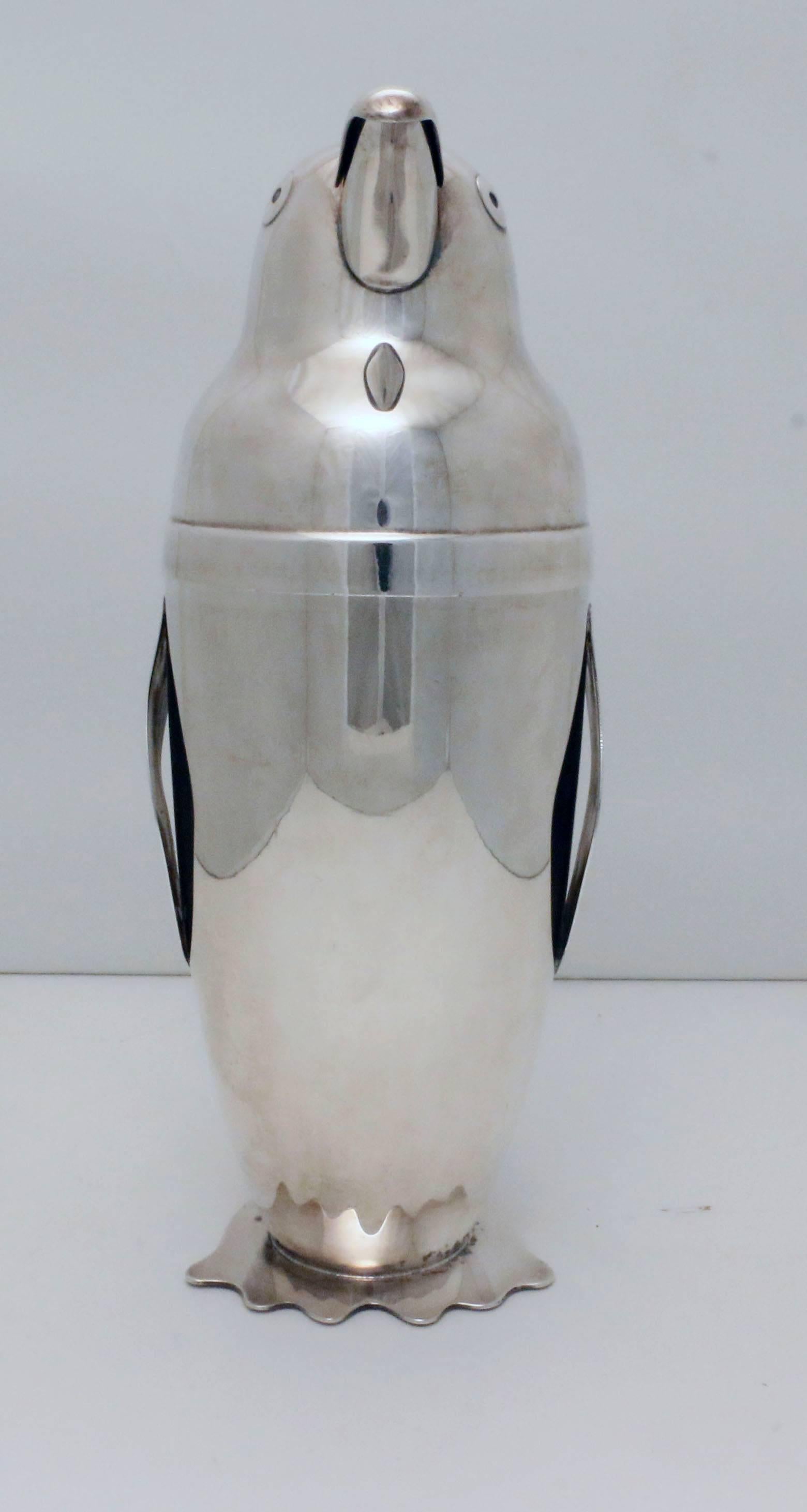 Art Deco silver plate cocktail Shaker designed as a penguin by Emil Schuelke for the Napier Co. of Meridien, Conn.
Stamped Napier to base pat. D-101559.