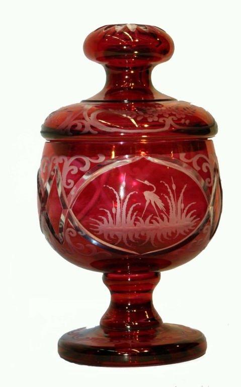 Bohemian ruby-flashed  footed covered sweetmeat ; cut to clear; with engraved reserves, depicting a stag, a goose, and a crane; knop on lid with cut starburst motif.