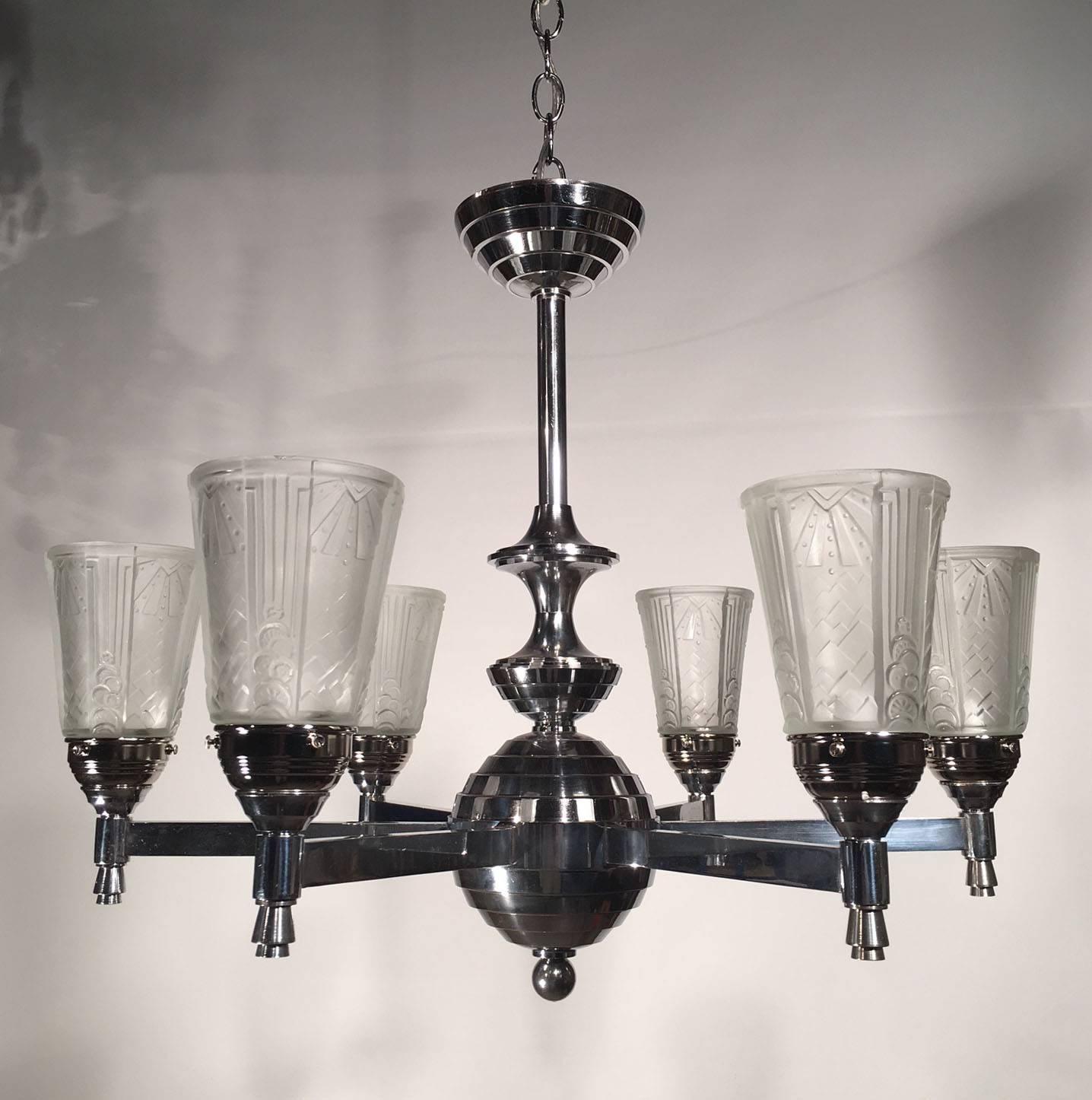 Art Deco six-light nickel plated chandelier with molded frosted glass shades.