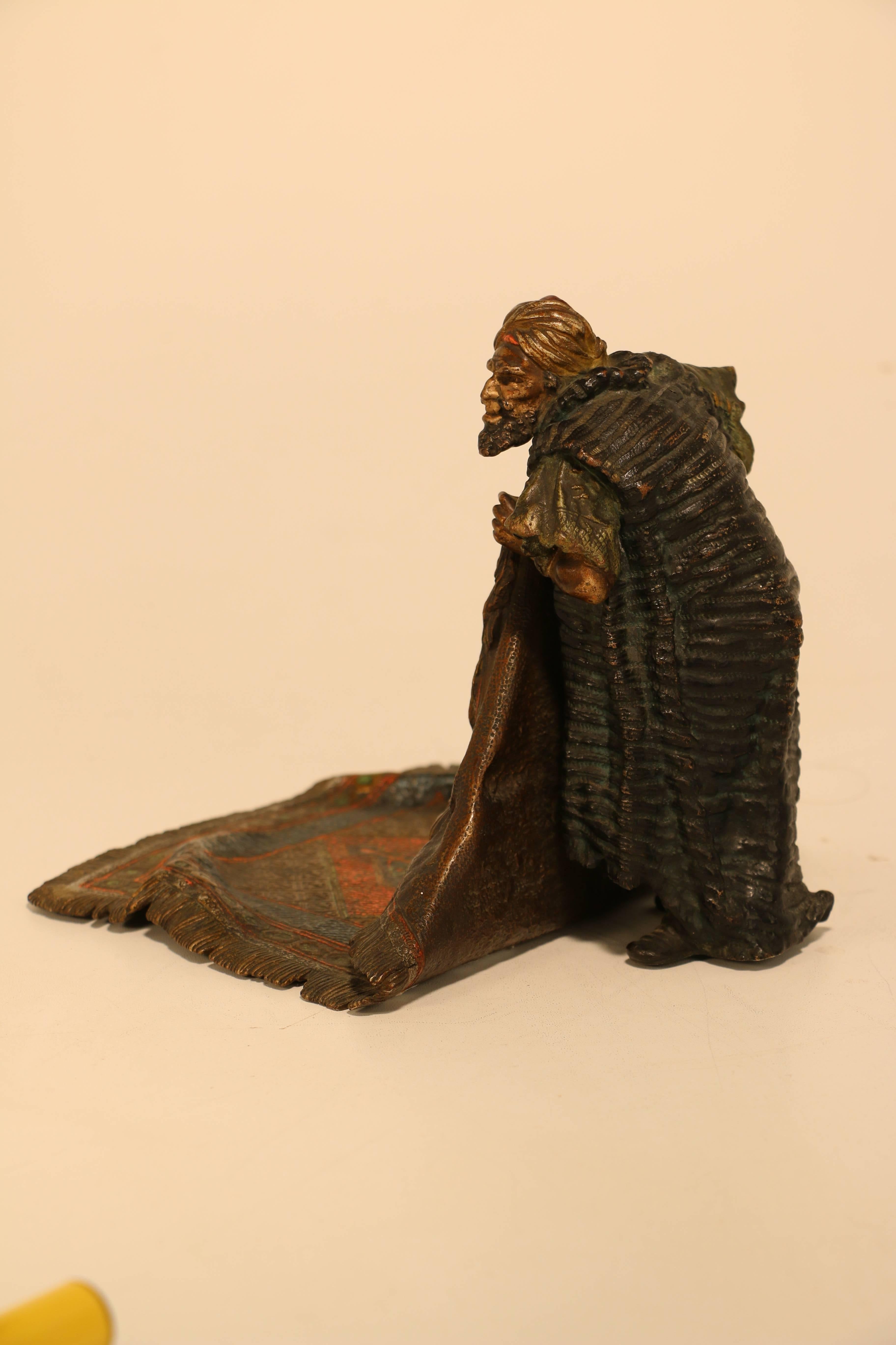 Cold-Painted Good Bergman Bronze of a Arab Carpet Dealer Showing His Wares