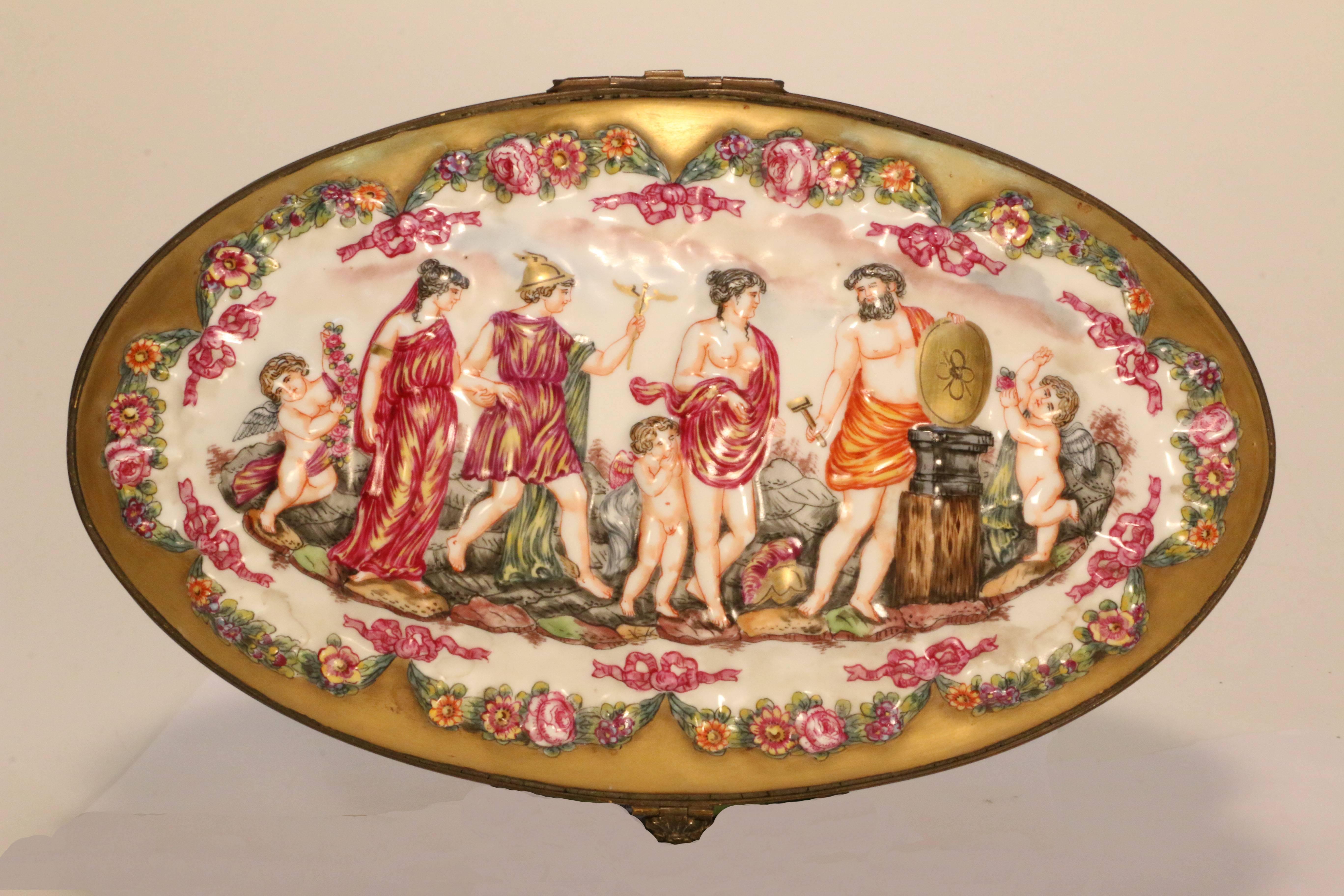 This box is an unusually large and decorative example of the work of this factory. Both highly ornamental and functional, it is ideal for dressing table or more formal settings. The decoration is molded with bas-reliefs and painted with scenes from