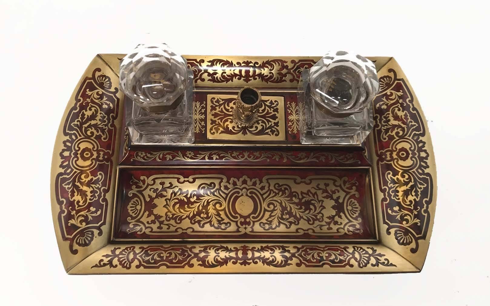 This inkstand exemplifies the excellence of French decorative accessories of the period. The design is well-thought out with everted edges, a trough-shaped depression for pens and even a candlestick for melting the sealing-wax wafers or sticks that