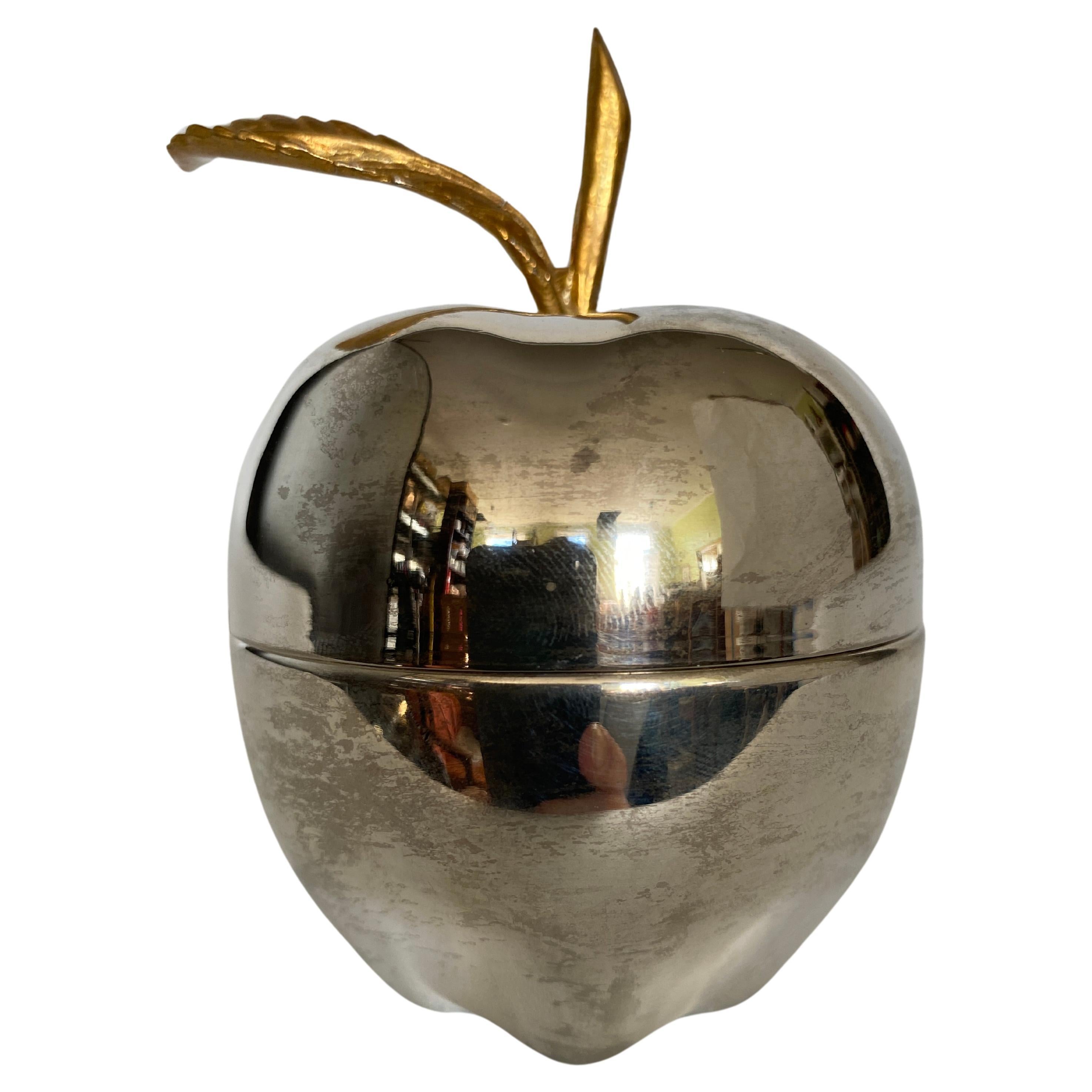 Lovely Hollywood Regency trinket box or bonbonniere in shape of an apple. The apple is silver plated and the leaf and branch is made of brass. 
The apple box has been polished. 
The last 2 pictures shows the apple box before polishing, showing