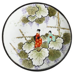 Hand-Painted Kutani Porcelain Charger with Women and Vine Arbor, Meiji Period