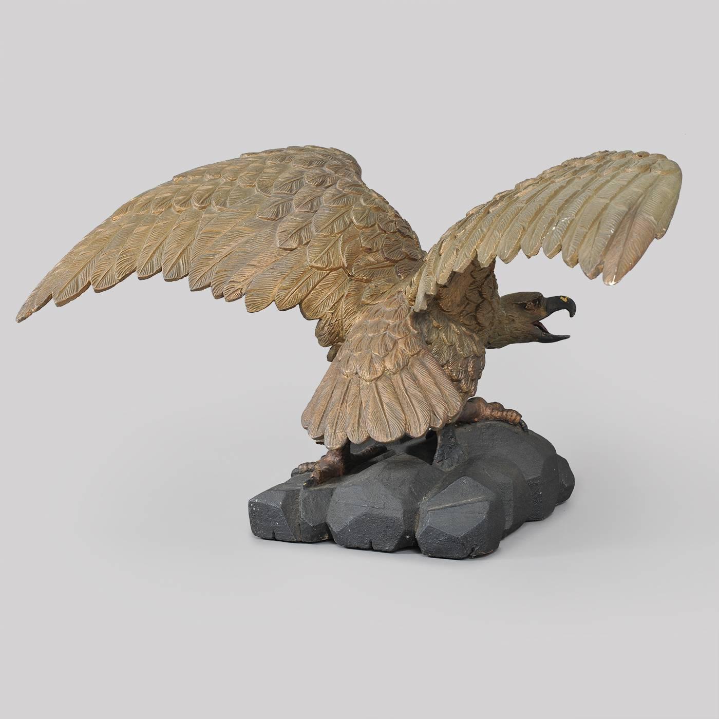 Folk Art Carved Eagle with Outstretched Wings Perched on Rocks