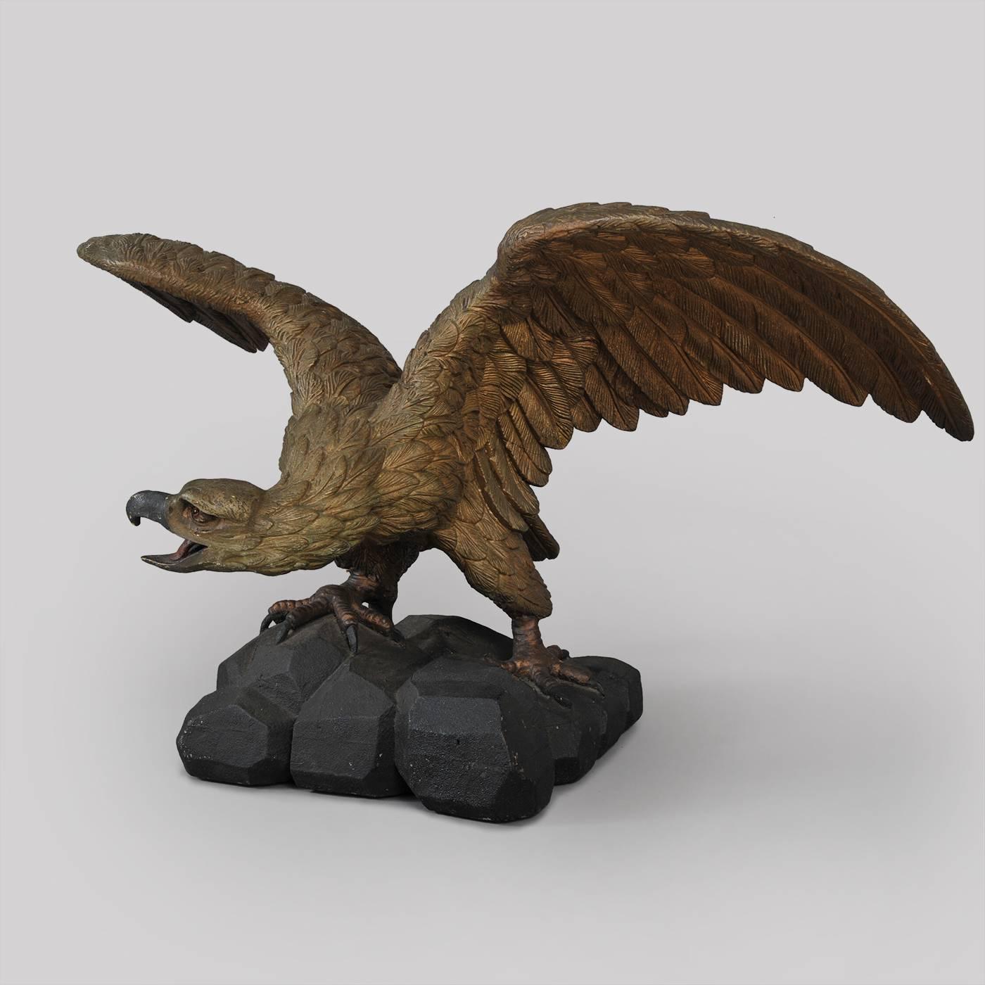 American. Probably Pennsylvania, early 19th century.
Exceptionally well carved pine with painted and gilt surface.
Condition: The eagle retains several surfaces of gilt and black paint, aged and oxidized due to outdoor elements, minor