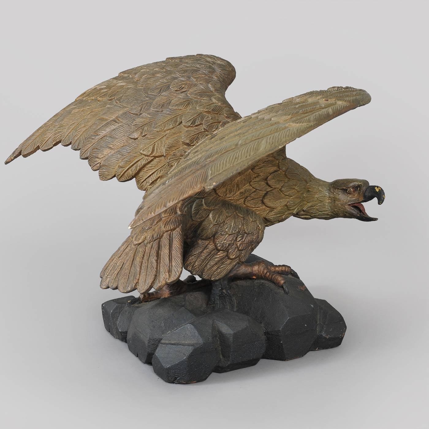 American Carved Eagle with Outstretched Wings Perched on Rocks