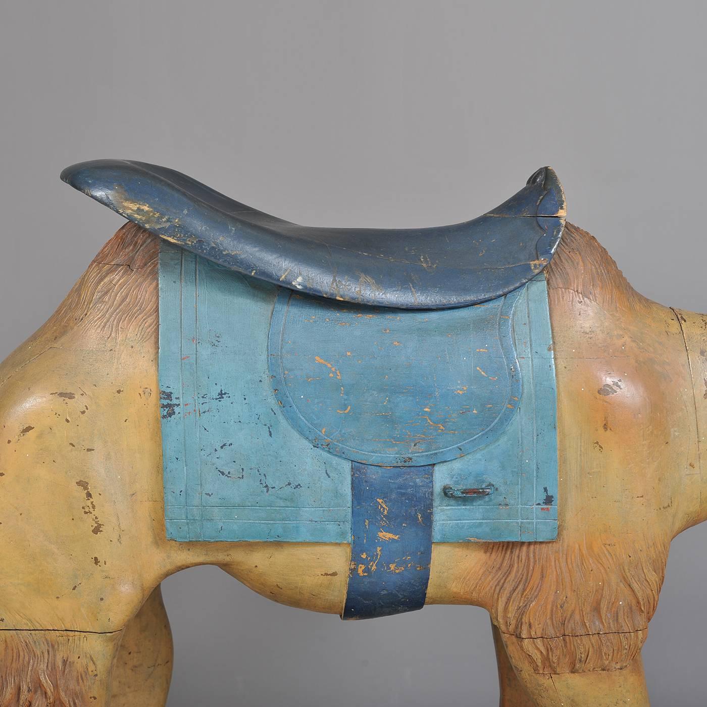 Camel
Charles Looff (1852-1918)
Circa 1880
Carved and polychrome wood
Condition: Excellent, substantially original paint, small loss at tail joint, replacement to center section of seat. Some second old paint primarily to saddle. 
Rare and striking