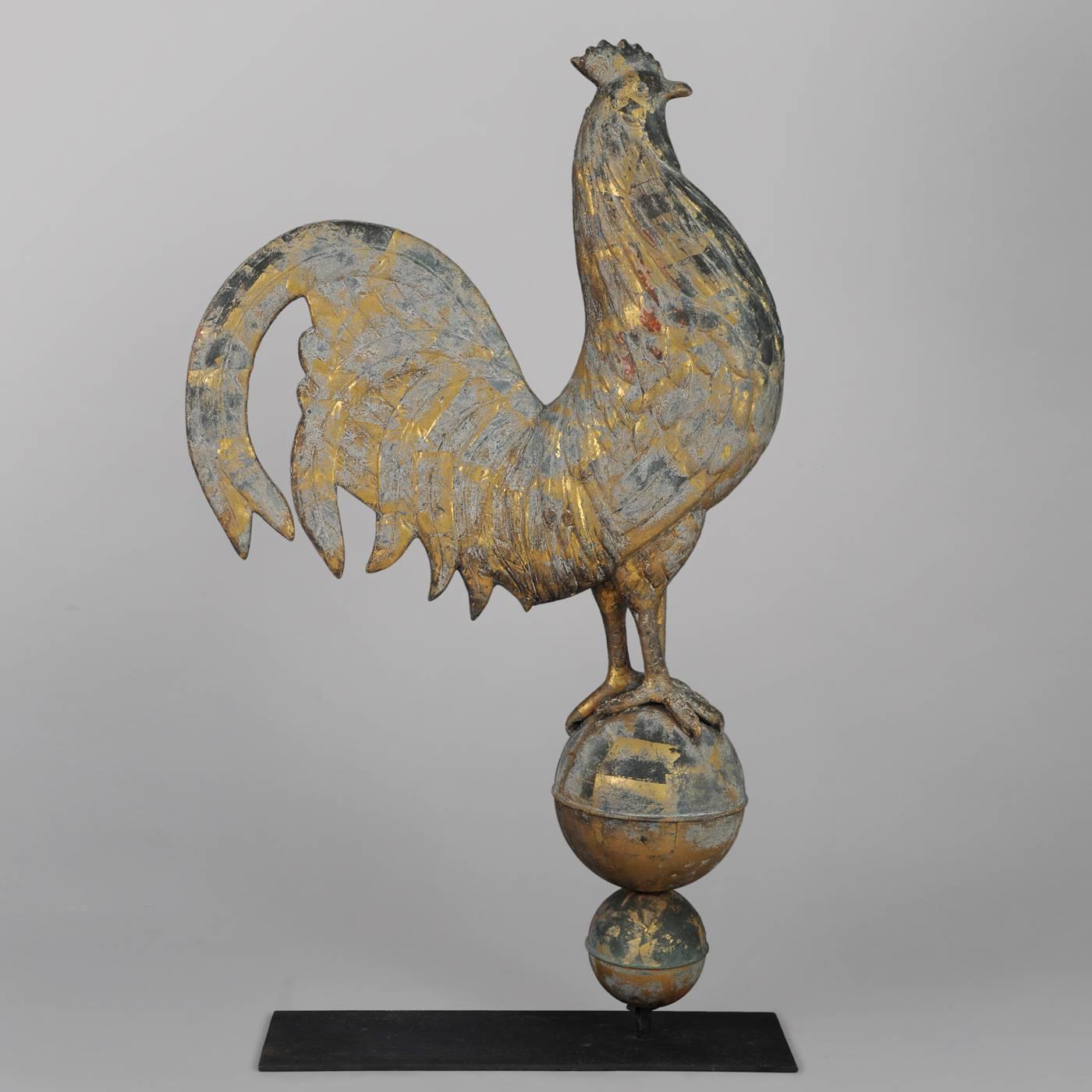 Probably Harris & Company, Boston, Massachusetts, circa 1880-1900.
Full-body copper, copper sphere.
Classic example of a Hamburg rooster having a full-chest perched on a sphere.
Wonderful condition. Original oxidized gilt surface with traces of