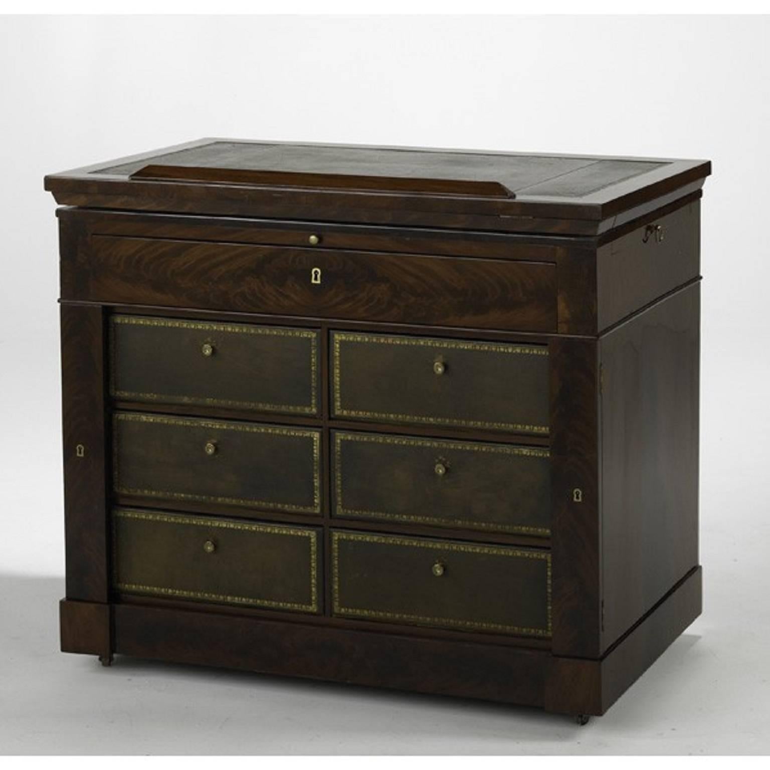 French Empire architect's desk. 

Flame grain mahogany veneers, leather covered drawers.