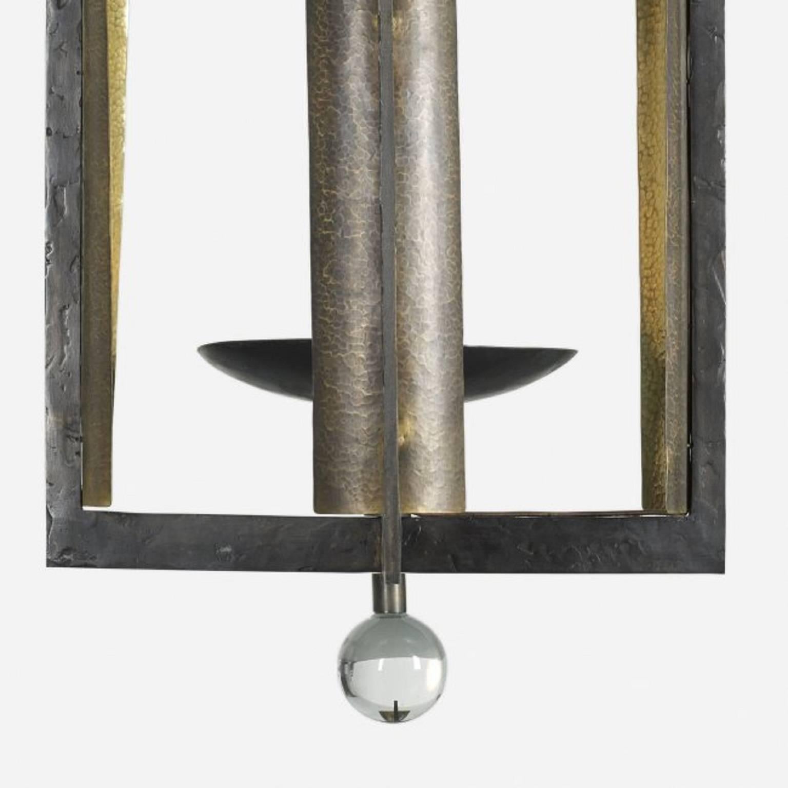 Hervé Van der Straeten chandelier from a Robert Couturier Interior
Patinated brass, hammered copper, crystal,
France, 2002-2006.
Signed with artist's cipher to applied label on fixture: [HV].

Commissioned by Robert Coururier.