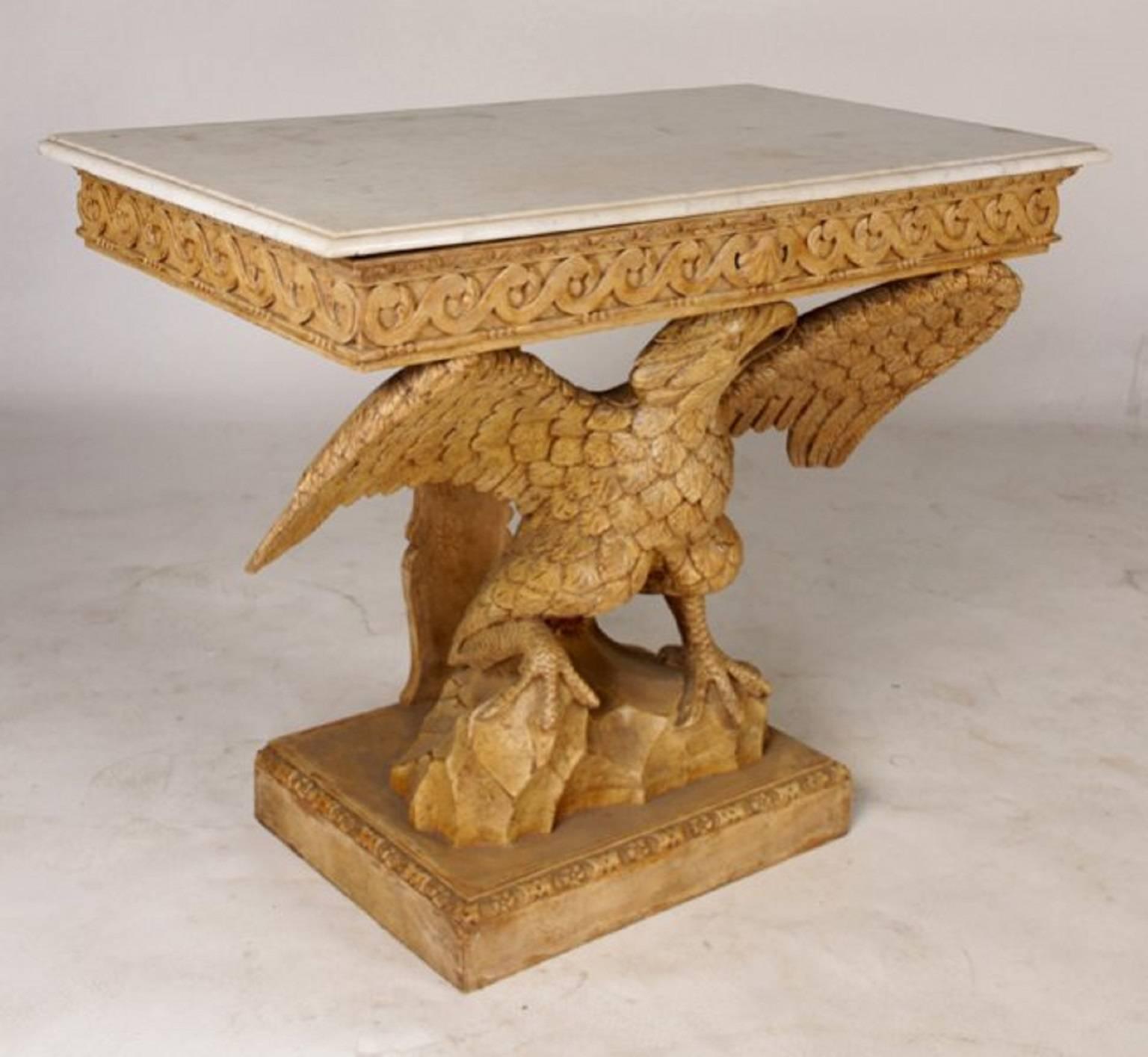 Carved wood eagle console with molded edge marble top over carved apron supported by a spread wing eagle. 

Supported on rusticated base and raised plinth.

A truly wonderful piece!