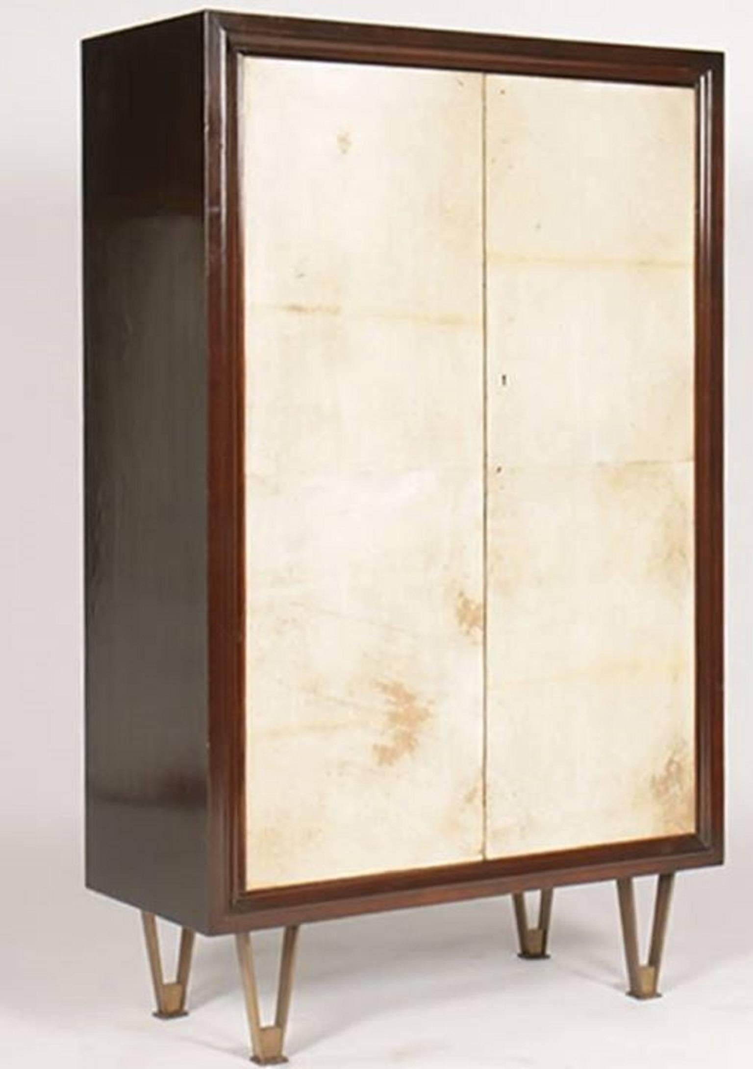 Tall, standing parchment and wood bar in the manner of André Arbus. 

Molded top and sides raised on bronze legs with a fitted interior. 

 