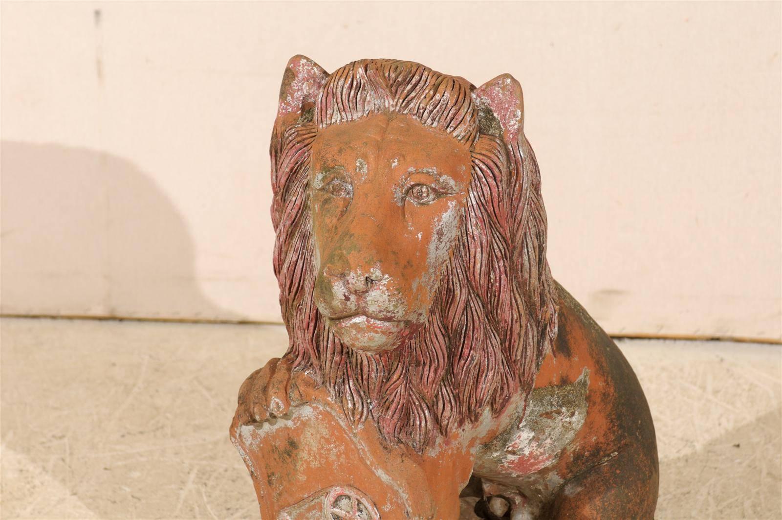 Painted British Colonial Terracotta Lion with Shield of Medium Size with Beautiful Aging