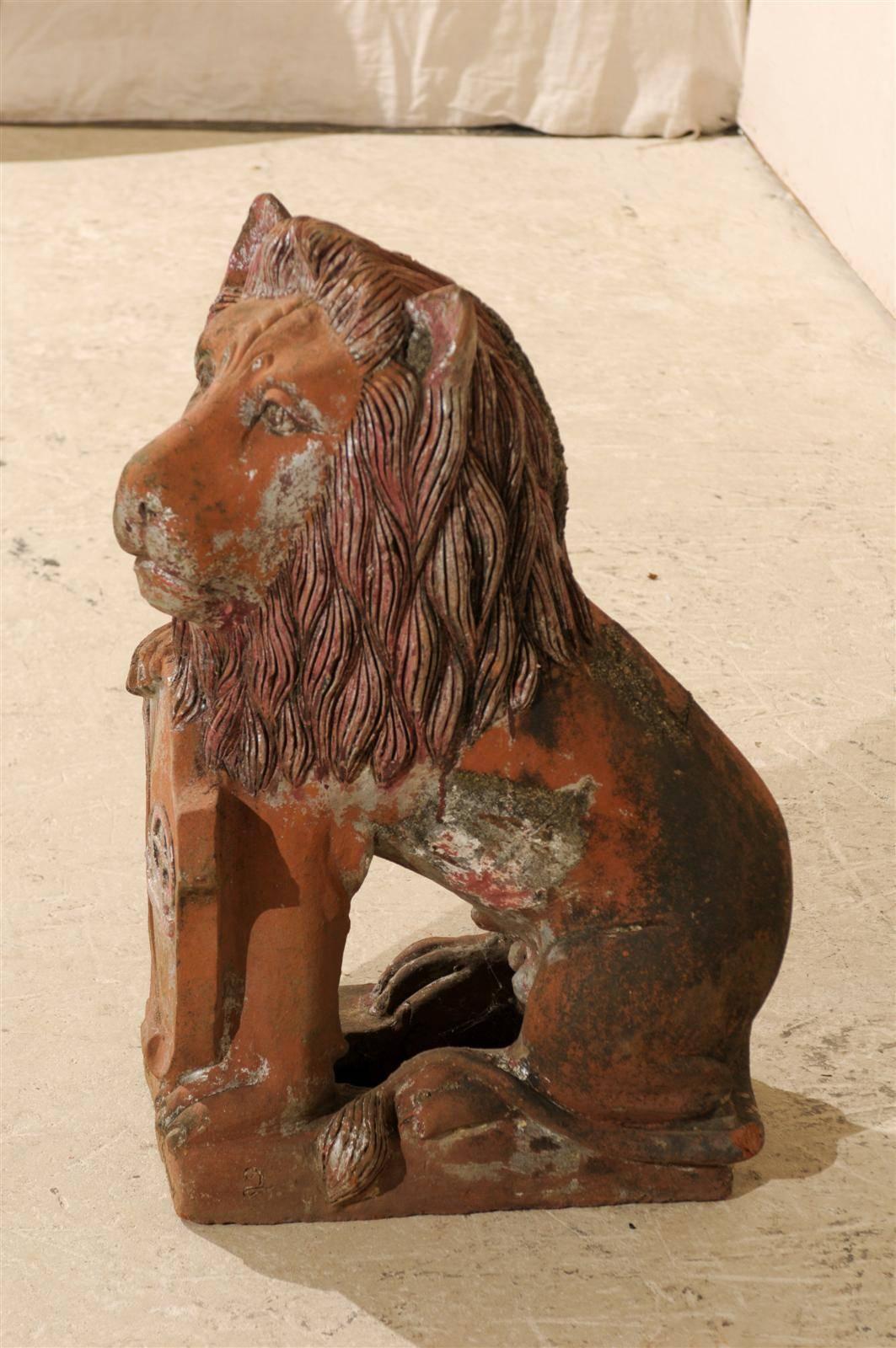 20th Century British Colonial Terracotta Lion with Shield of Medium Size with Beautiful Aging