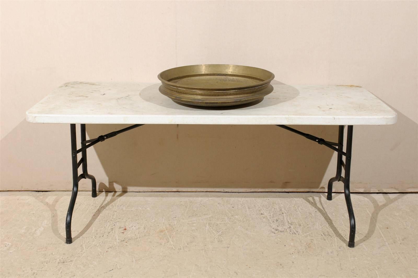 A large size brass uruli cooking bowl from South India. An uruli is a traditional cookware extensively used is South India. Urulis were used in homes for cooking and in ayurvedha to take medicines. Nowadays, urulis are used as a decorative bowl to