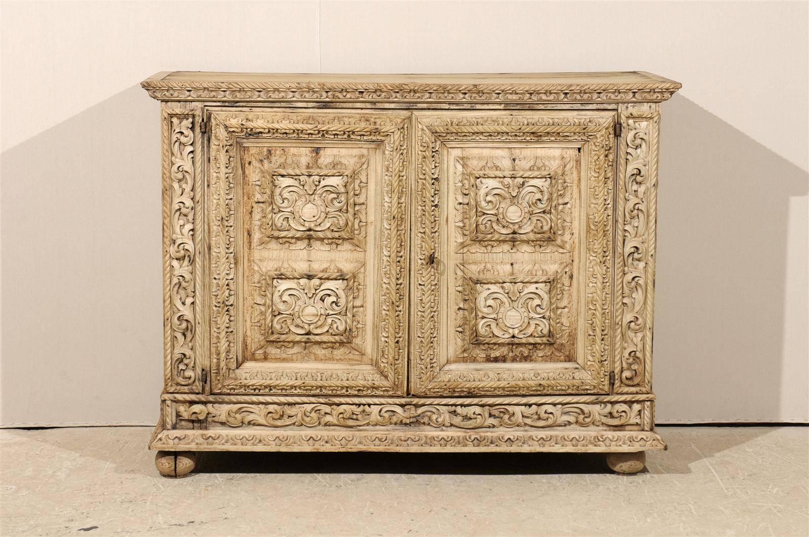 Metal An Italian 18th Century Two-Door Bleached Wood Credenza Richly Carved with Age