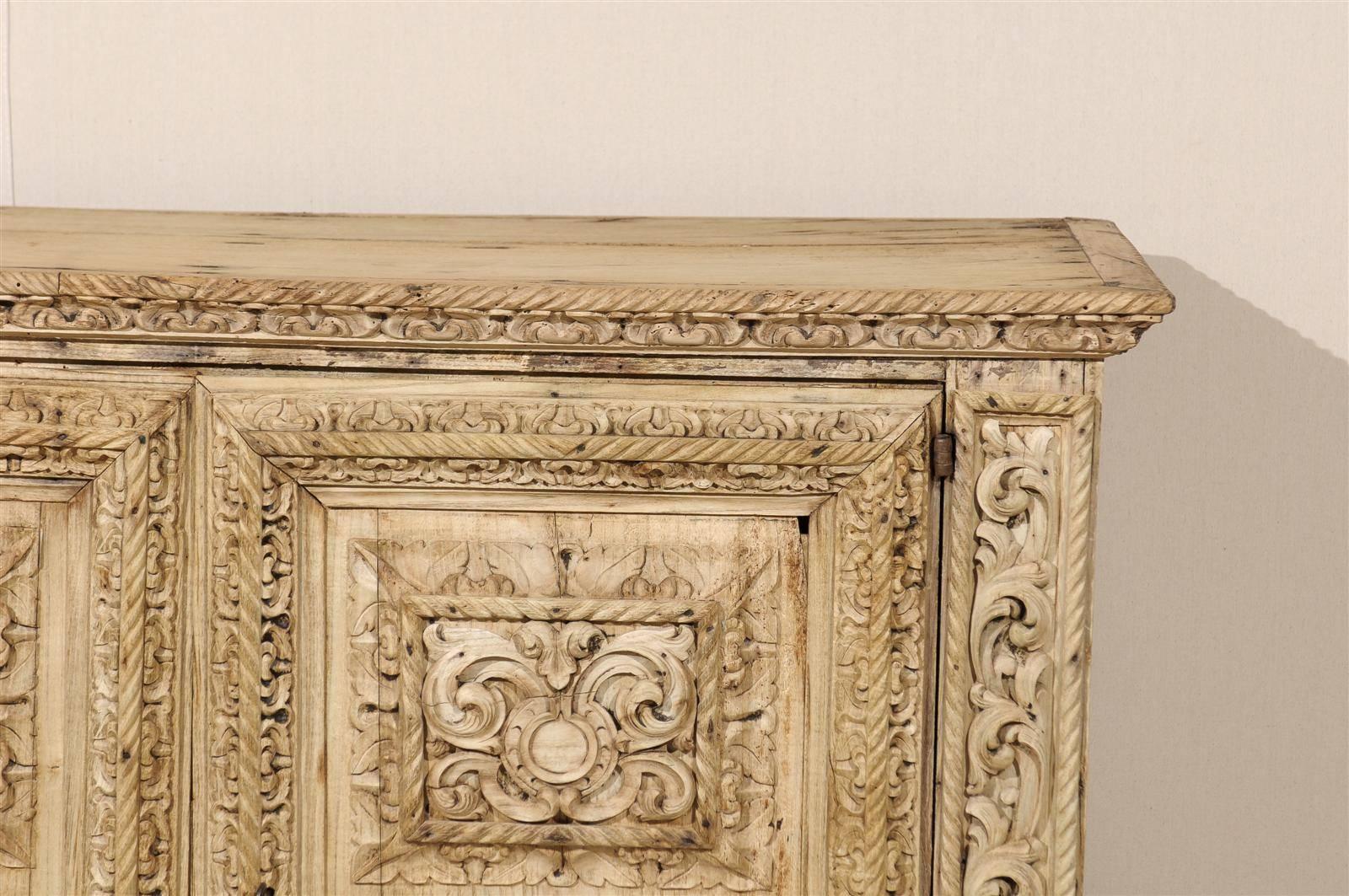 An Italian 18th Century Two-Door Bleached Wood Credenza Richly Carved with Age In Good Condition In Atlanta, GA