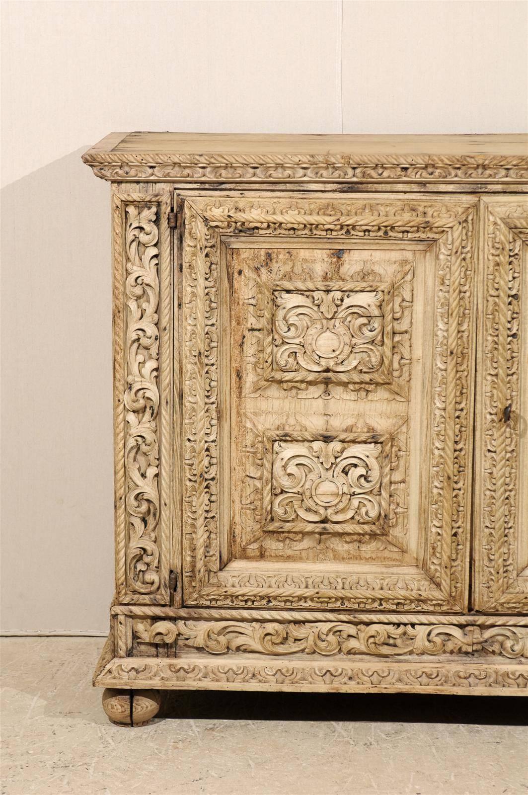 18th Century and Earlier An Italian 18th Century Two-Door Bleached Wood Credenza Richly Carved with Age