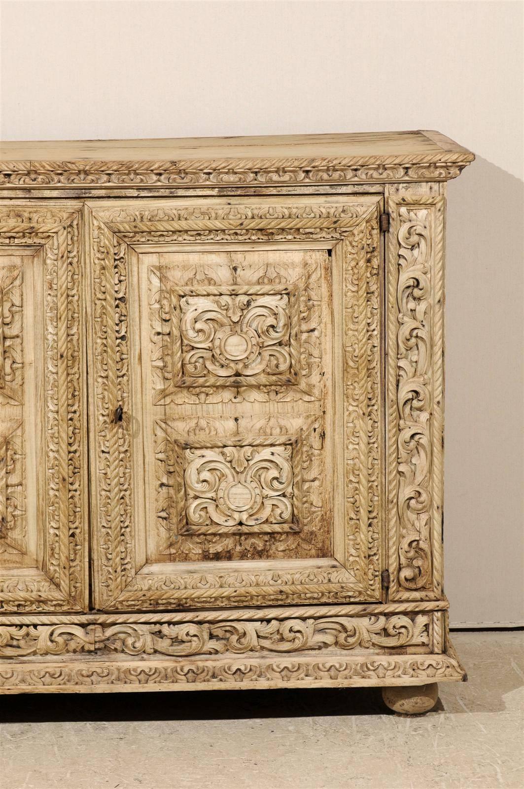 An Italian 18th Century Two-Door Bleached Wood Credenza Richly Carved with Age 1