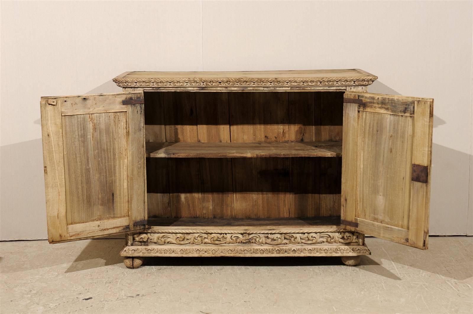 An Italian 18th Century Two-Door Bleached Wood Credenza Richly Carved with Age 2