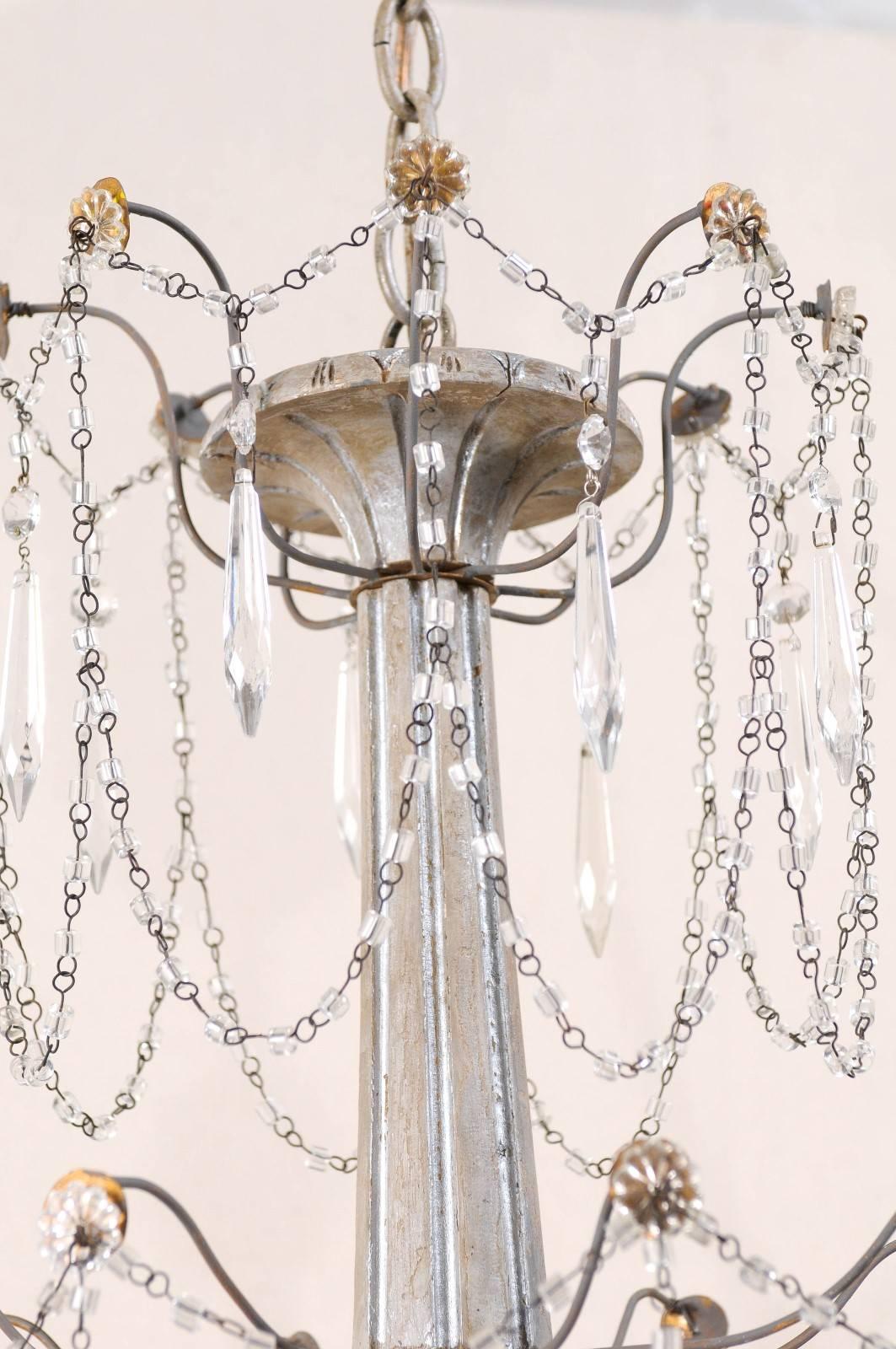 20th Century Italian Eight-Light Wood, Crystal and Metal Painted Silver Three Tier Chandelier