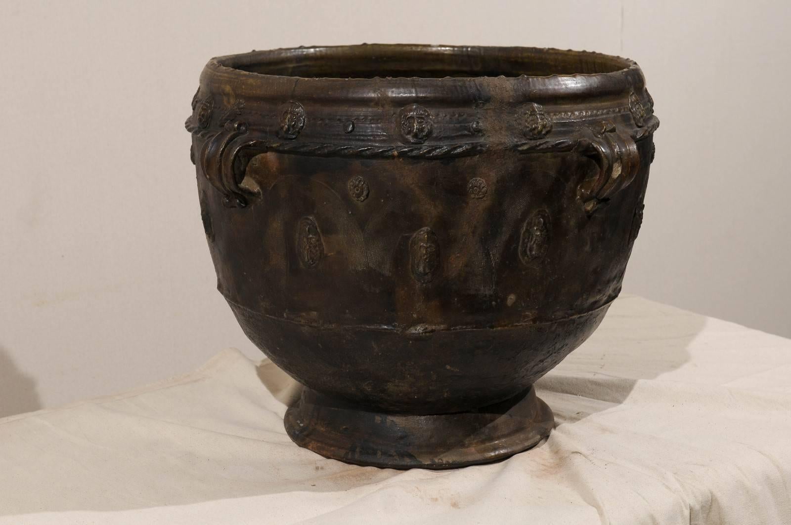 Brown-Black Colored Clay Jar with Four Handles and Decorative Motifs In Good Condition For Sale In Atlanta, GA