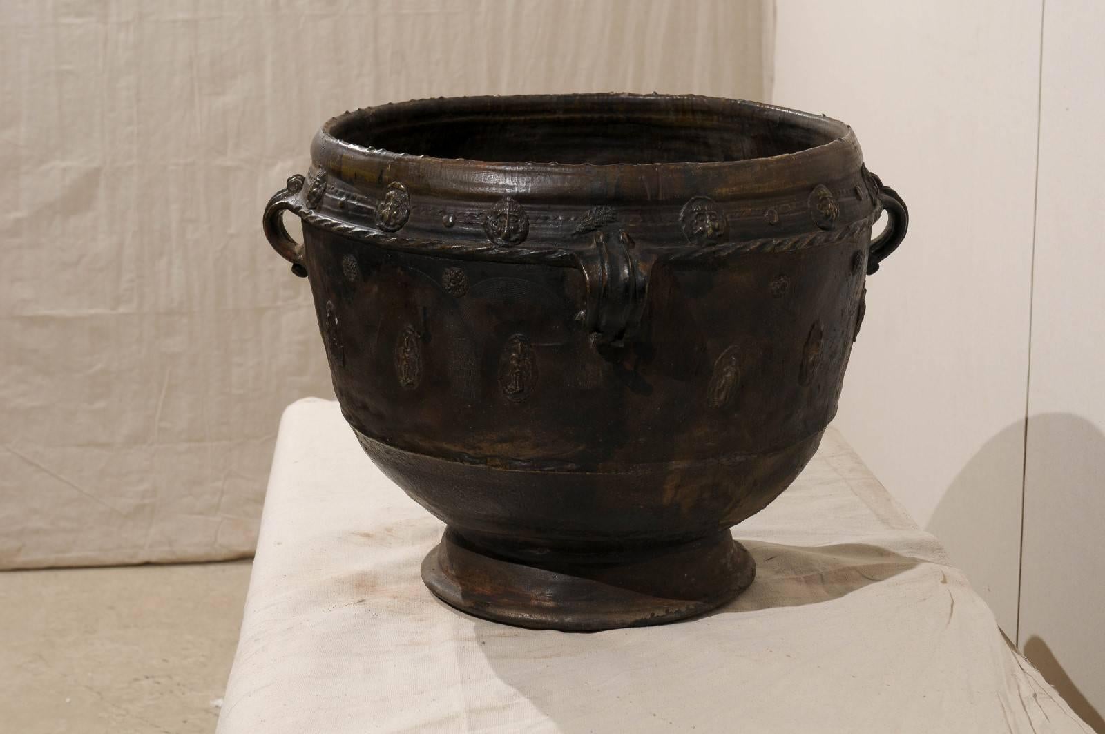 20th Century Brown-Black Colored Clay Jar with Four Handles and Decorative Motifs For Sale