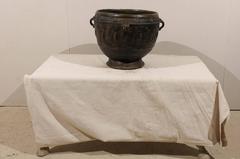 Brown-Black Colored Clay Jar with Four Handles and Decorative Motifs