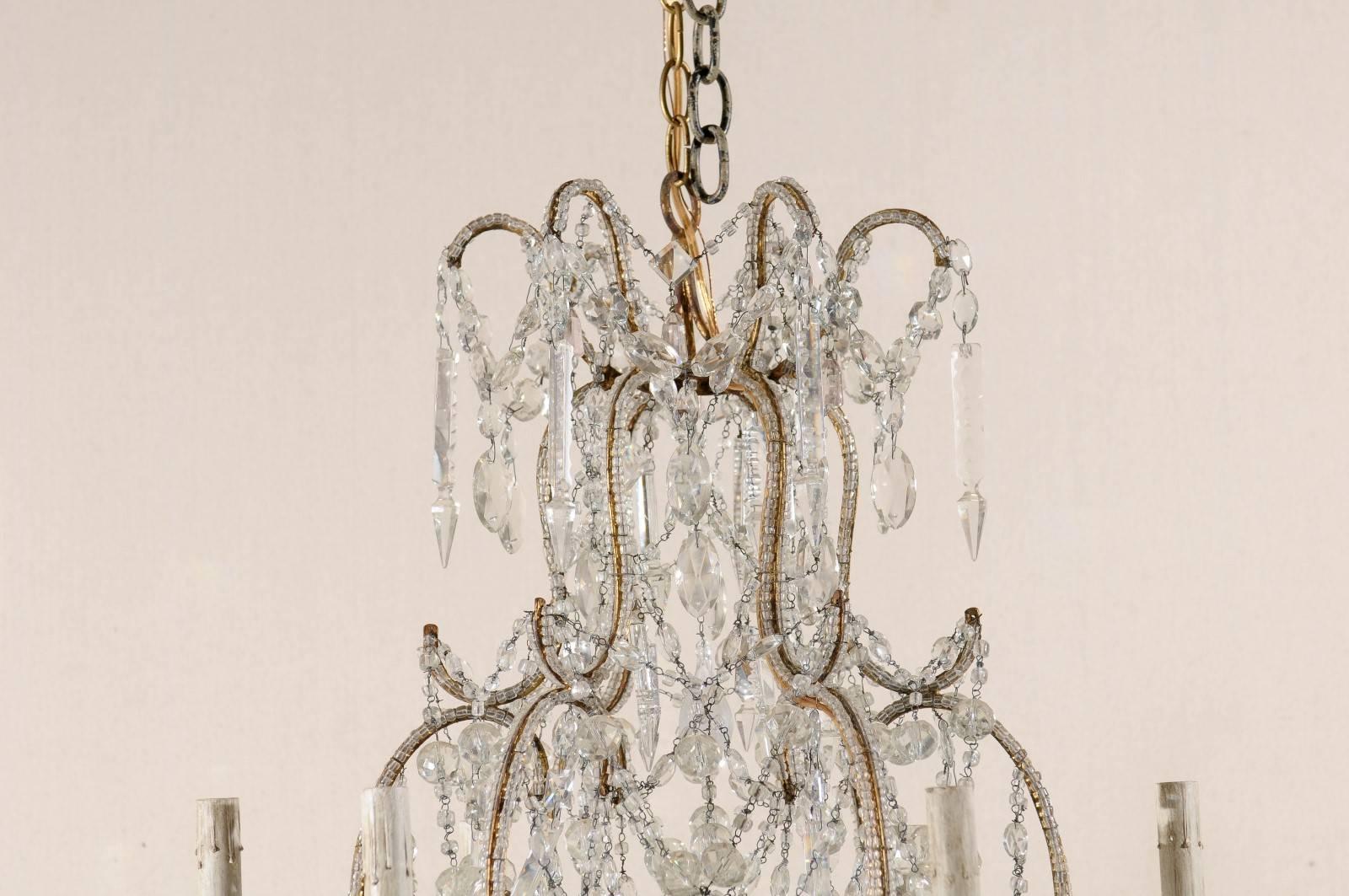 Beaded French Crystal and Gilded Iron Chandelier with Scroll Arms and Ornate Beading