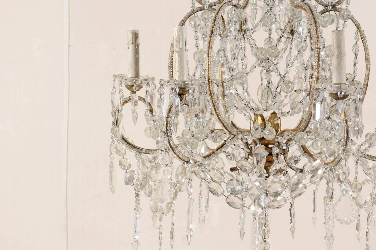20th Century French Crystal and Gilded Iron Chandelier with Scroll Arms and Ornate Beading