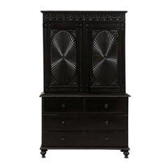 Richly Carved Shiny Black British Colonial Cabinet with Oval Pattern on Doors