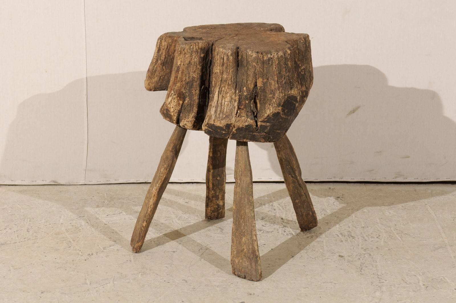 A rustic tree stump drink table. This tree stump drink table gives any space a touch of rustic nature and is also functional. Pull this table up to your chair and use it as a handy surface to rest a book or a beverage.