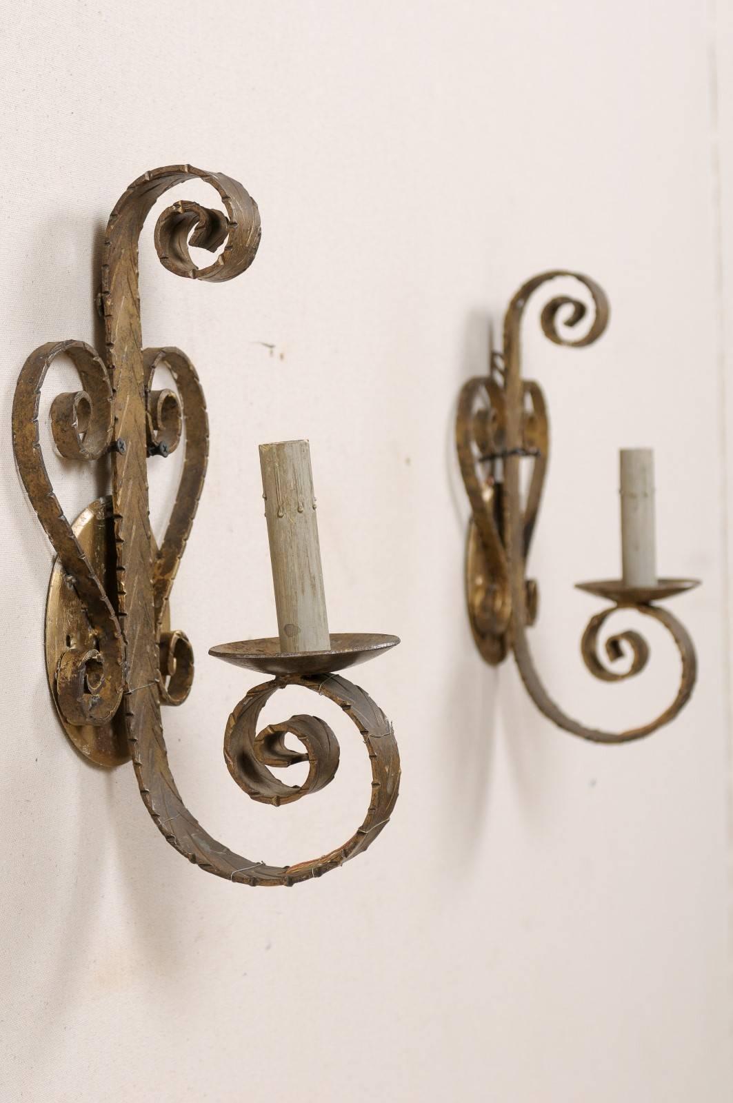 Mid-Century Modern Pair of Spanish Single Light Sconces Each Flanked by Scroll Motifs For Sale