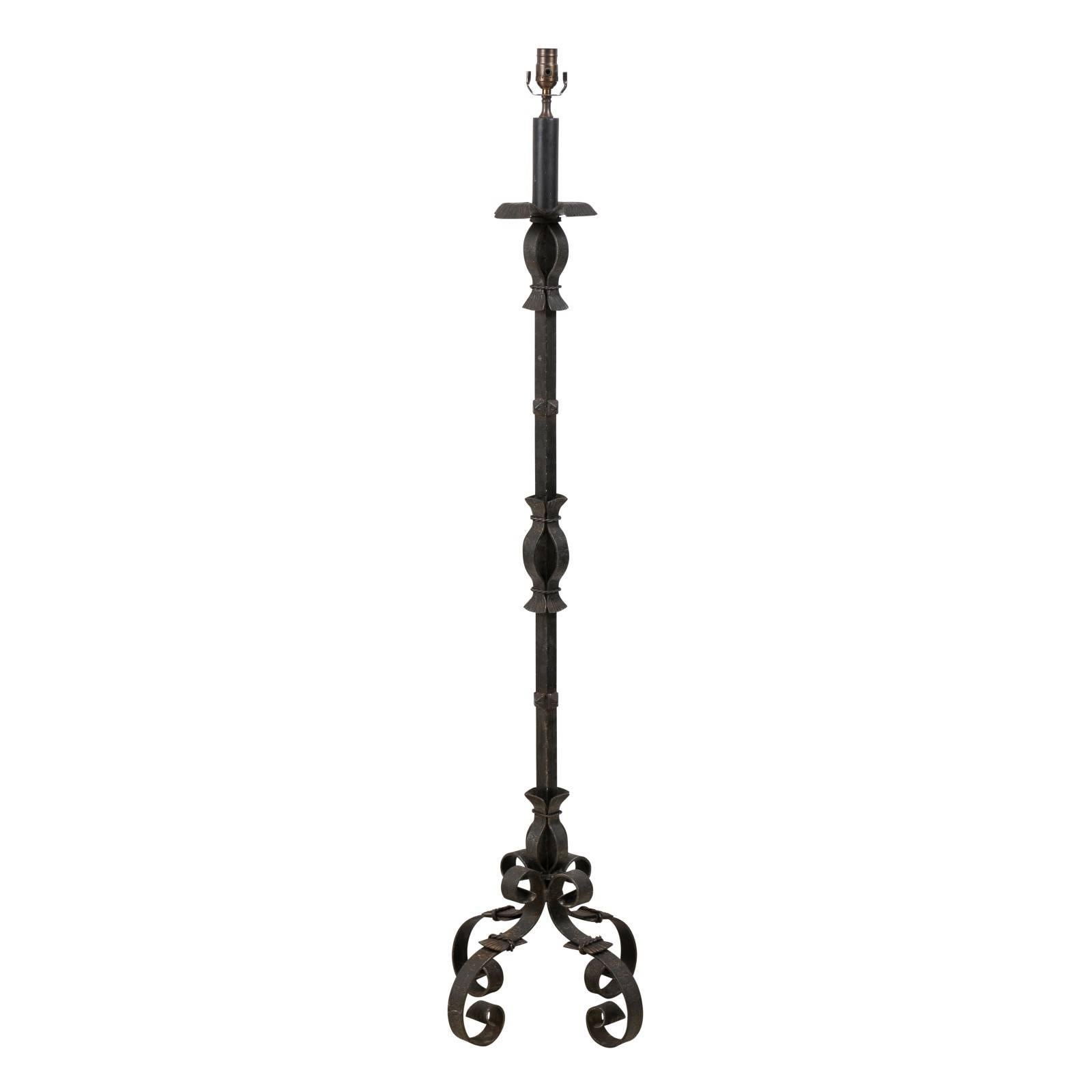 Elegant French Forged Iron Floor Lamp in Black Color on Four Scrolled Feet For Sale