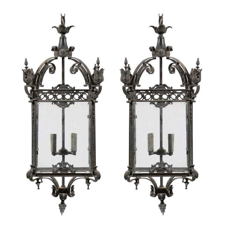 Pair of Large Sized Ornately Decorated Dark Colored Iron FourLight