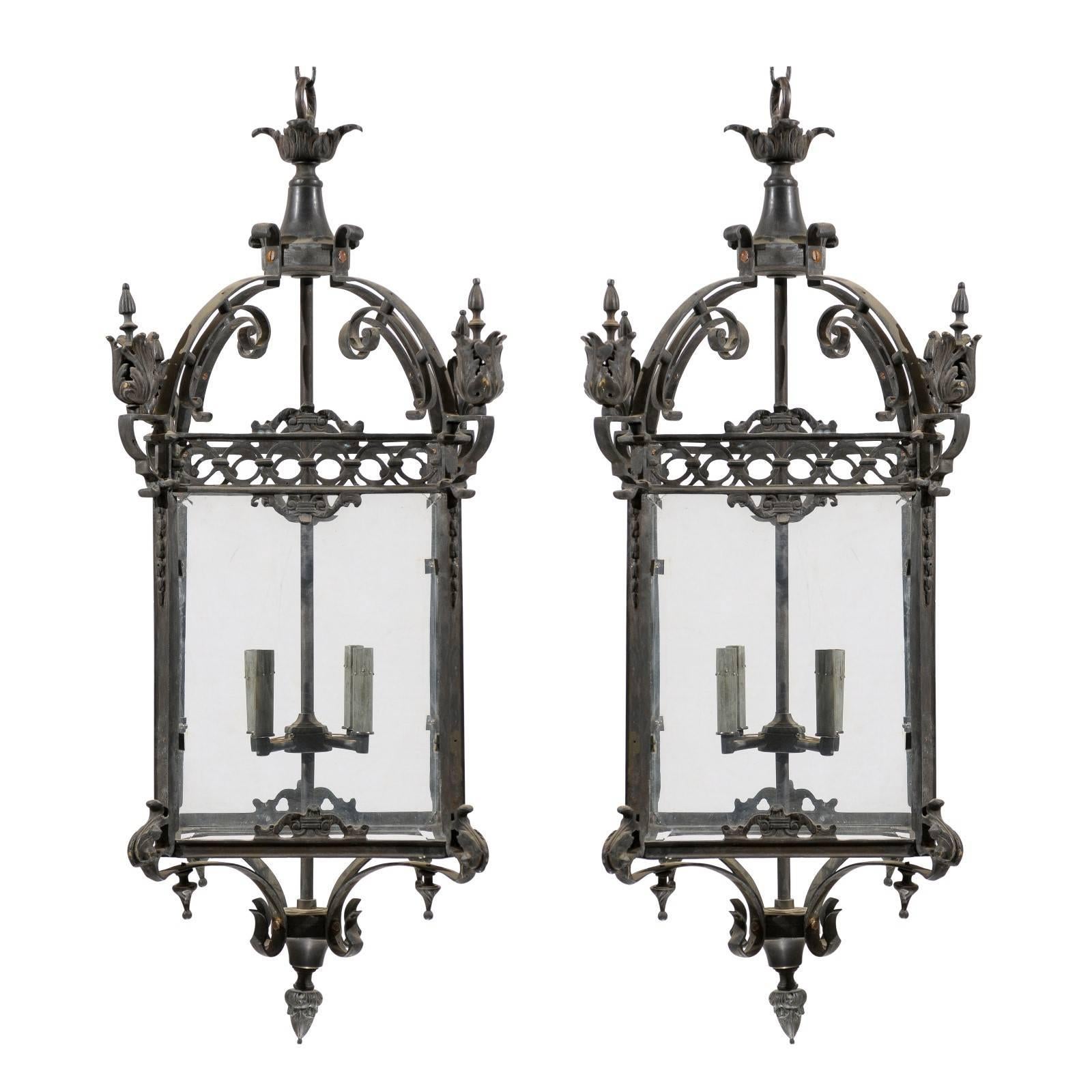 Pair of Large Sized Ornately Decorated Dark Colored Iron Four-Light Lanterns
