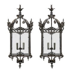 Pair of Large Sized Ornately Decorated Dark Colored Iron Four-Light Lanterns