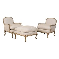 Three-Piece Set of French Bergères Chair Pair with Pouf / Ottoman, Neutral Tones