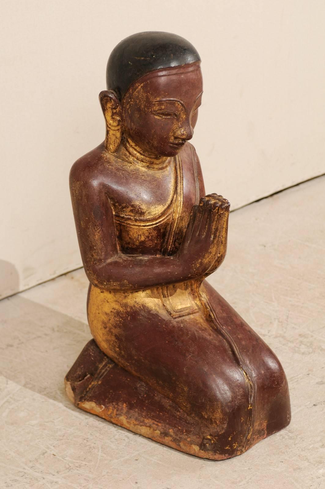 A 19th century sandstone Buddha figure. This Buddha figure of sandstone was hand-carved during the 19th century, though quite possibly the late 18th century. The carved sandstone was finished in a dry lacquer and gilt, and is a beautiful