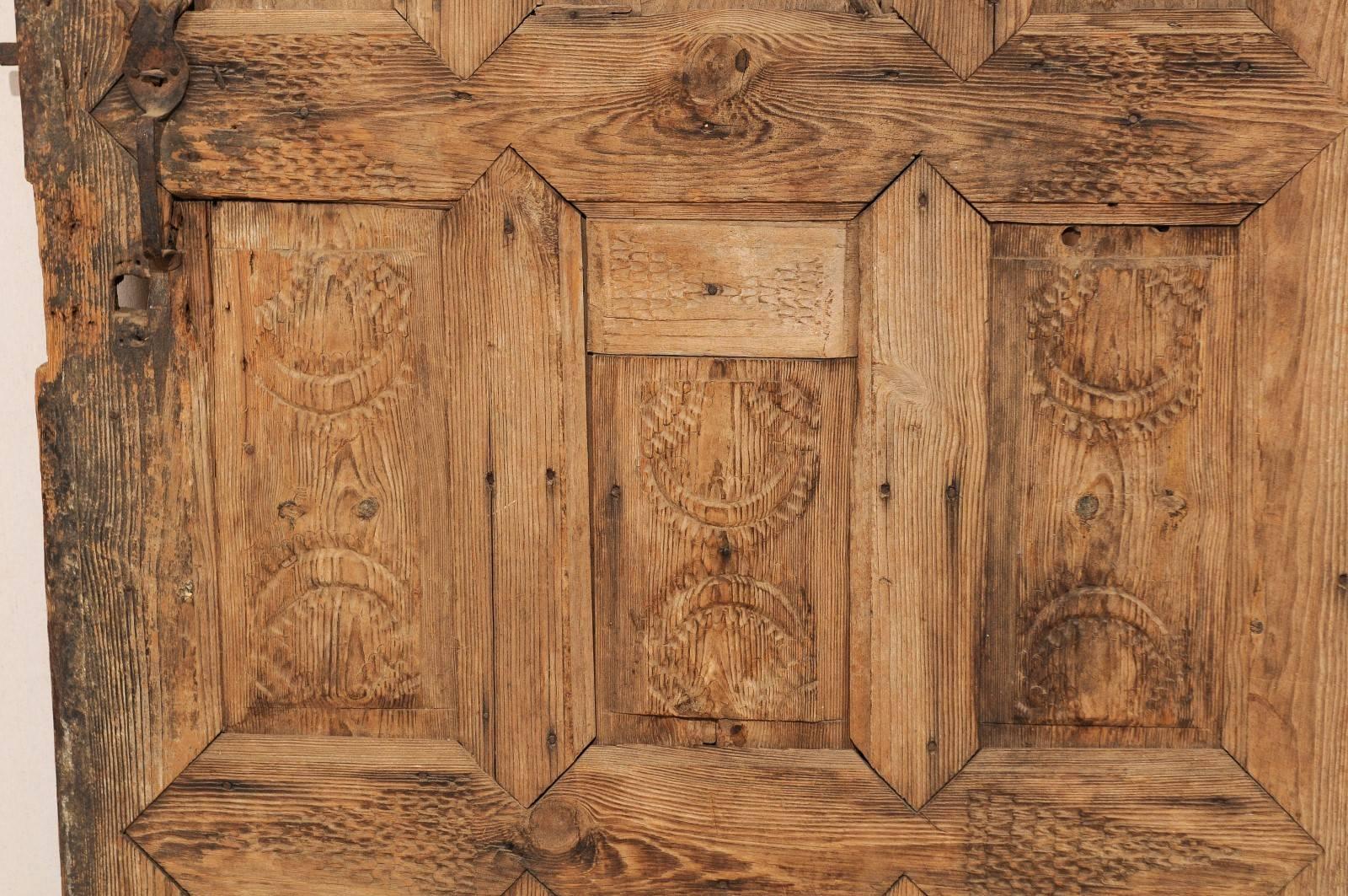 Single 19th Century European Rustic Wood Door with Delicate Carved Pattern In Good Condition In Atlanta, GA