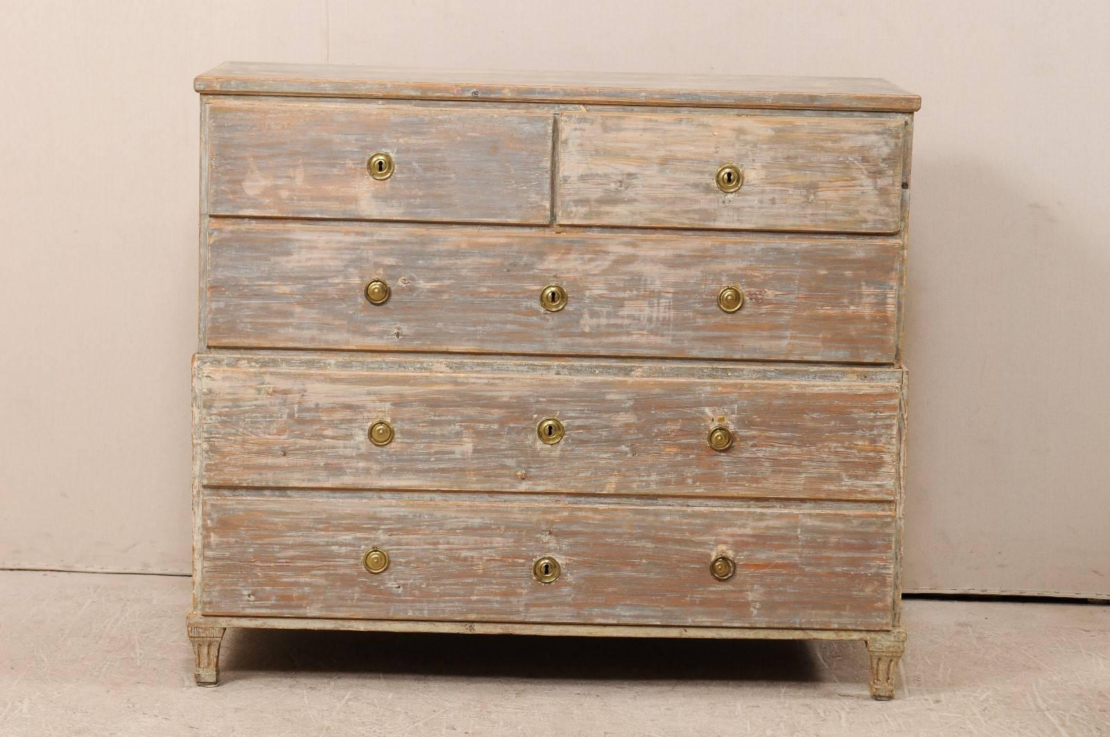 A late 18th century Swedish chest of drawers. This Swedish antique chest features two small drawers over three larger drawers. The chest also has a unique feature, being that the top half can easily be separated from the bottom. This makes for ease