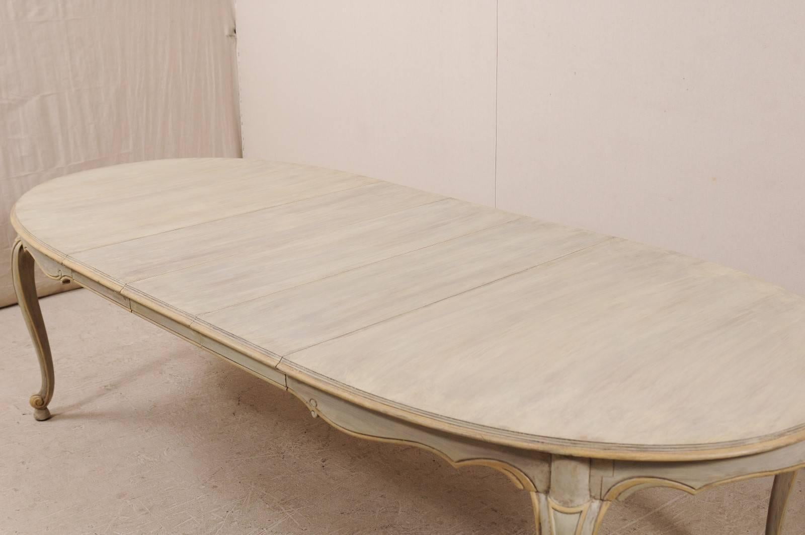 20th Century Lovely Painted Wood Neutral Oval Dining Table with Carved and Outlined Skirt