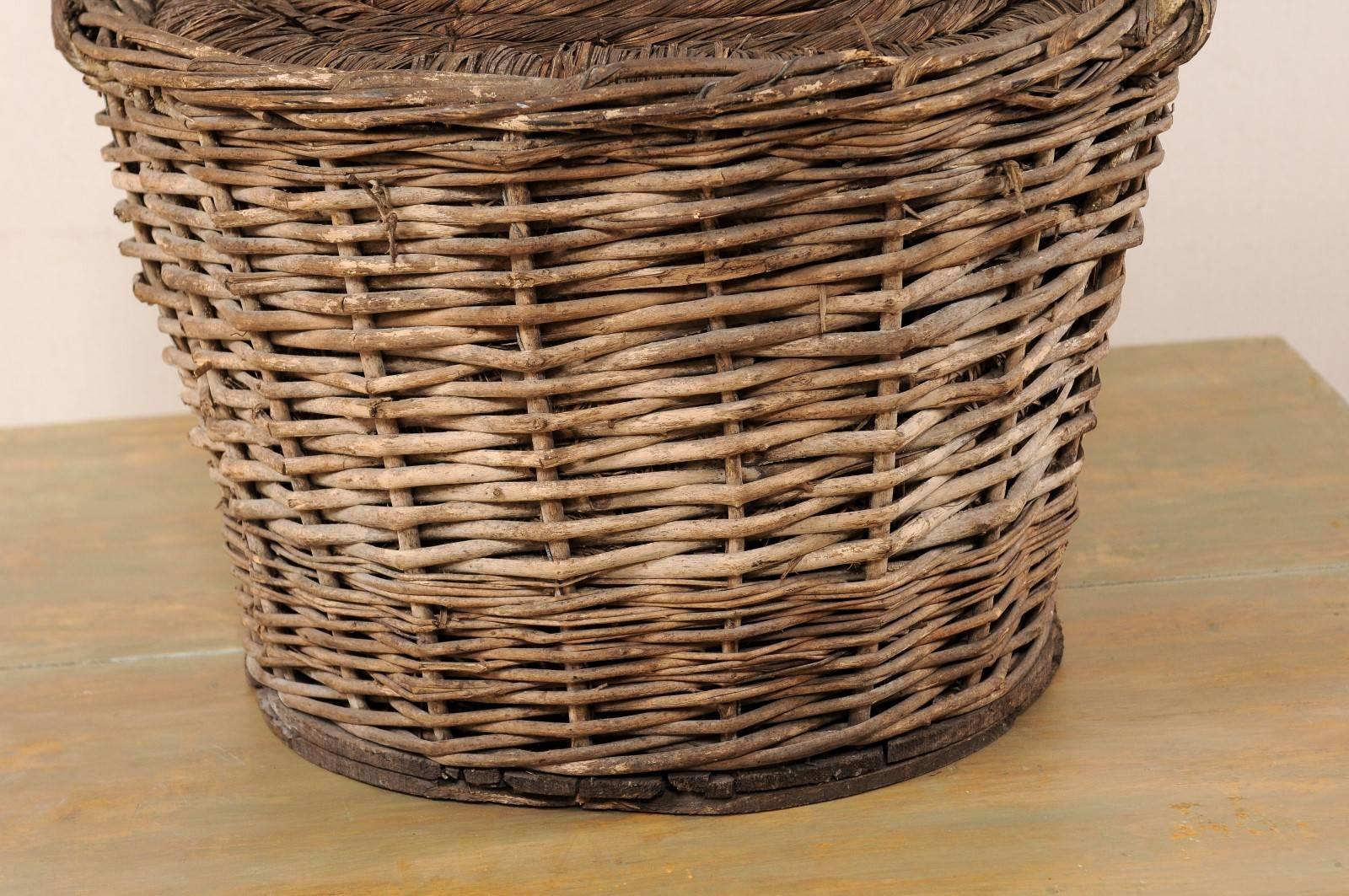 20th Century French Mid-Century Handwoven Basket with a Large Demijohn Glass Wine Bottle
