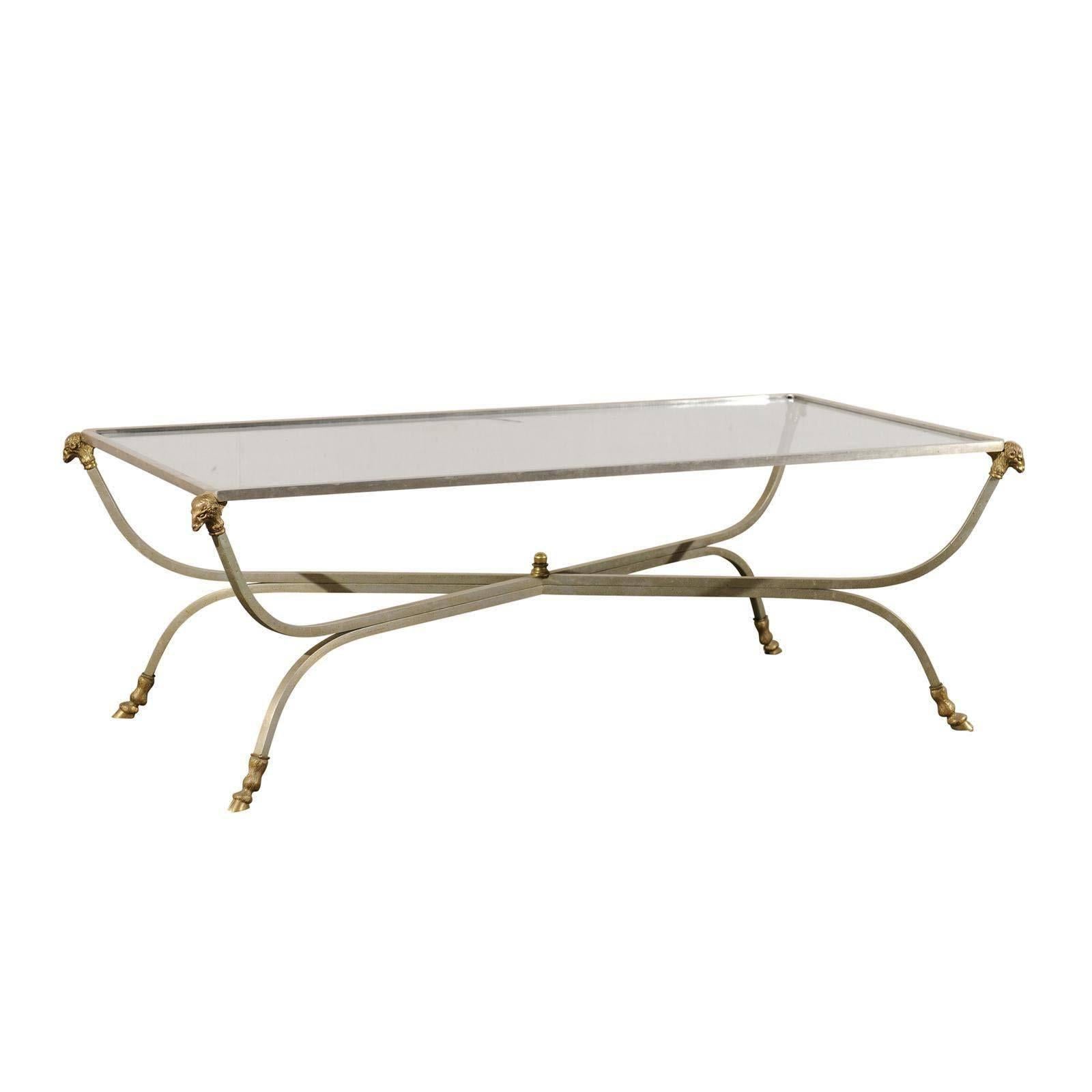 Elegant Glass Top Coffee Table with Ram
s Head Ornaments and Hoofed Feet