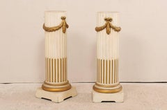 Pair of French Mid-20th Century Painted Cream and Gold Columns with Swag Motif